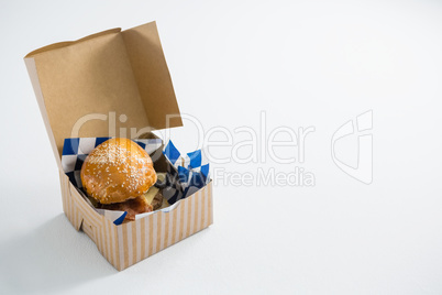 High angle view of cheeseburger in box