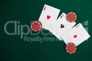 Playing cards and casino chips on poker table