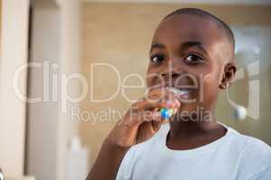 Close-up portrait of smiling boy with toothbrush