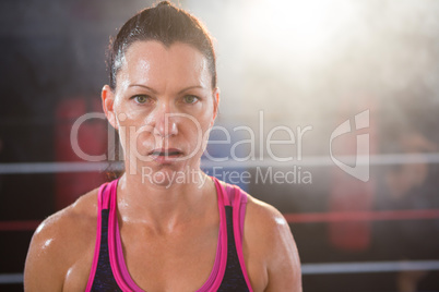 Portrait of confident female boxer