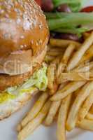 Hamburger and french fries on table