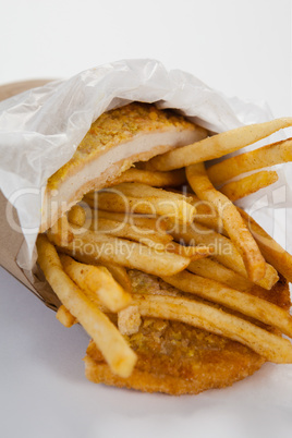 French fried chips in a take away paper bag