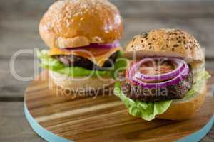 Close up of burgers on cutting board