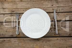 Overhead view of empty plate with cutlery
