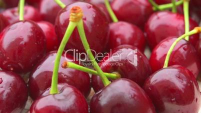 Fresh, collected cherries  slowly rotate