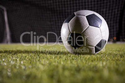 Close-up of soccer ball on playing field