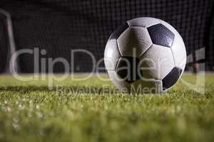 Close-up of soccer ball on playing field