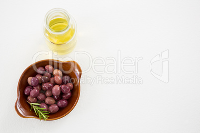 Marinated olives with oil bottle