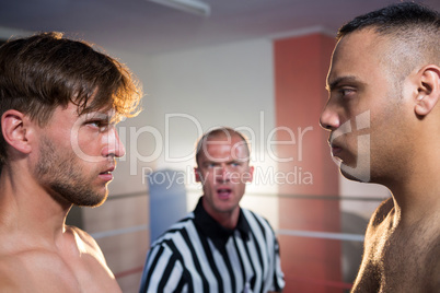 Side view of boxers staring at each other