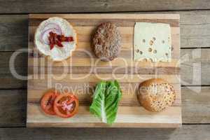 Sliced vegetables ingredient for making hamburger on chopping board