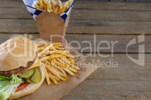 Close-up of hamburger and french fries in take way bag