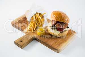 High angle view of hamburger with french fries and dip