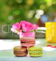 multicolored macaroons on a white wooden table