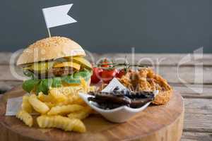 Vegetables with fried food by burger