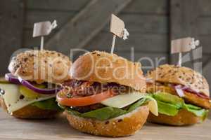 Various hamburger with tag on wooden table