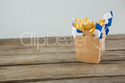 Close up of French fries on table