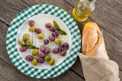 Marinated olives with oil and bread