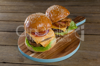 Hamburgers on chopping board