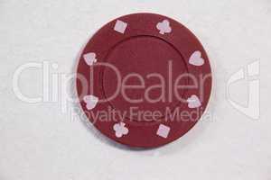 Red casino chip on white background