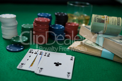 Close-up of whisky and money during poker game