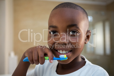 Close-up portrait of boy with toothbrush