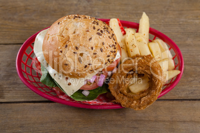 Hamburger and french fries in basket