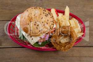 Hamburger and french fries in basket