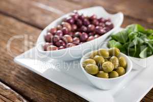 Marinated olives with herbs in bowl