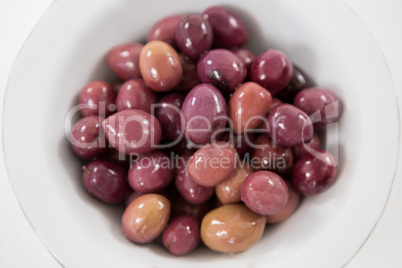 Marinated olives in white bowl