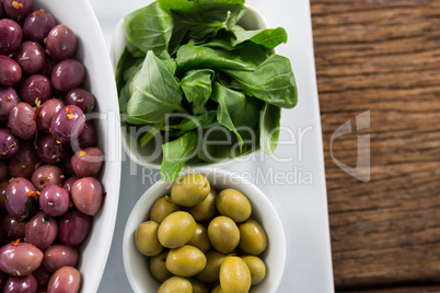 Marinated olives with herbs in bowl