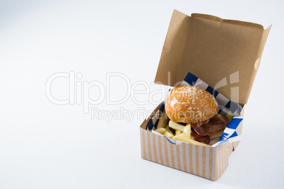 Close up of burger and French fries in box