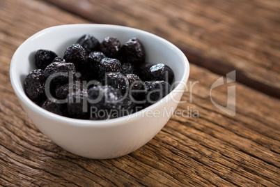 Dry olives in white bowl