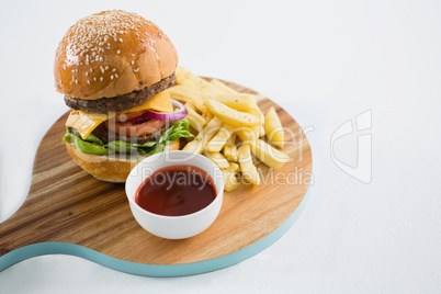 High angle view of hamburger with french fries and sauce