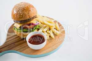 High angle view of hamburger with french fries and sauce