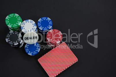 High angle view of cards and chips on table