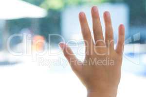 Close up of hand touching glass