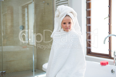 Portrait of girl sitting on bathtub