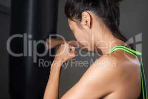 Woman practicing boxing in fitness studio