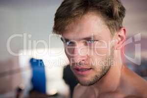 Close-up portrait of confident young male boxer