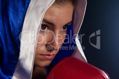 Determined woman wearing boxing robe