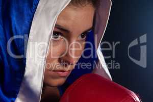 Determined woman wearing boxing robe