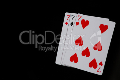 Close-up of three cards