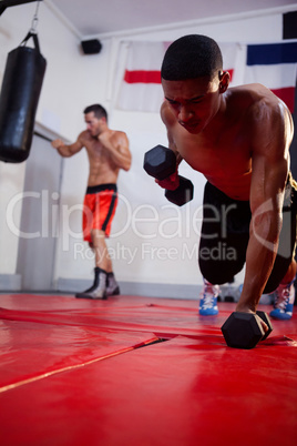 Men exercising in fitness studio