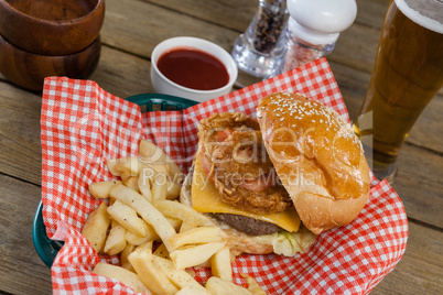 Burger and french fries in wicker basket