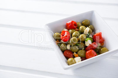 Marinated olives with herbs and spice in bowl