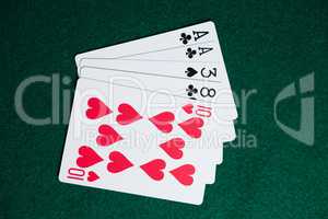 Playing cards arranged on poker table