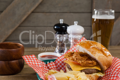 Burger and french fries in wicker basket