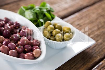 Marinated olives with herbs in bowl