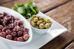 Marinated olives with herbs in bowl