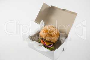 High angle view of cheese burger in box